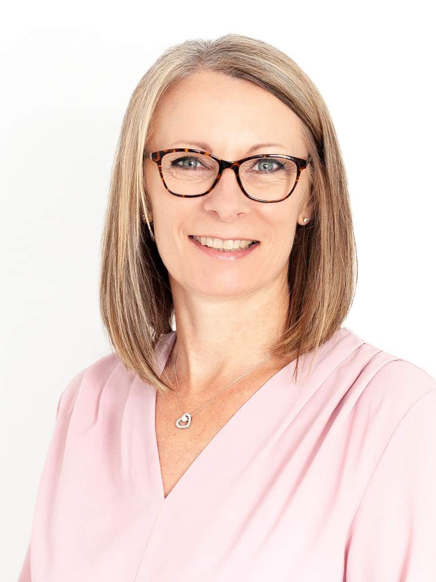 angela-bottger A portrait photo of Angela Bottger, owner of AB Client Solutions. Angela is smiling and relaxed, looking into the camera, wearing tortoiseshell glasses and a light pink top.
